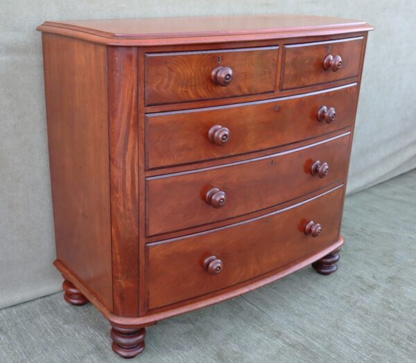 Early Victorian flame mahogany bow fronted chest of drawers