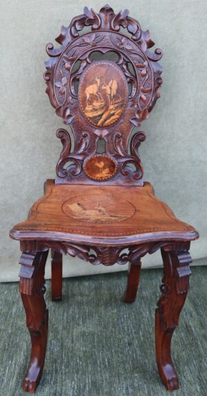 Late 19thC Swiss black forest walnut and marquetry hall chair.