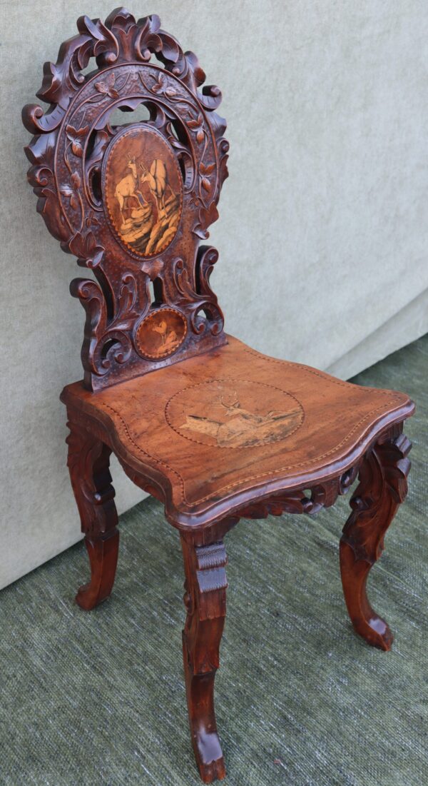 Late 19thC Swiss black forest walnut and marquetry hall chair.